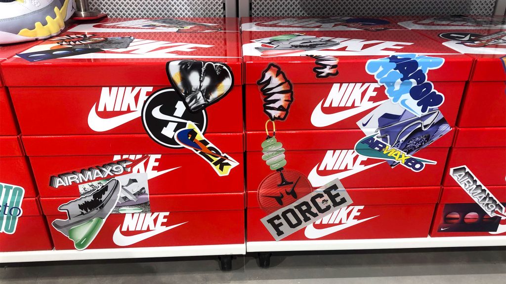 Boxes of Nike shoes adorned in grafitti stickers