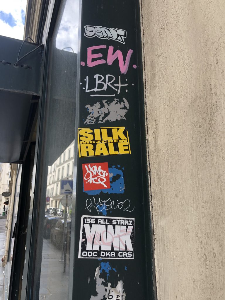 The tagged entryway of a building in Paris